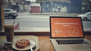 Impression from inside a café, with a laptop and a beverage